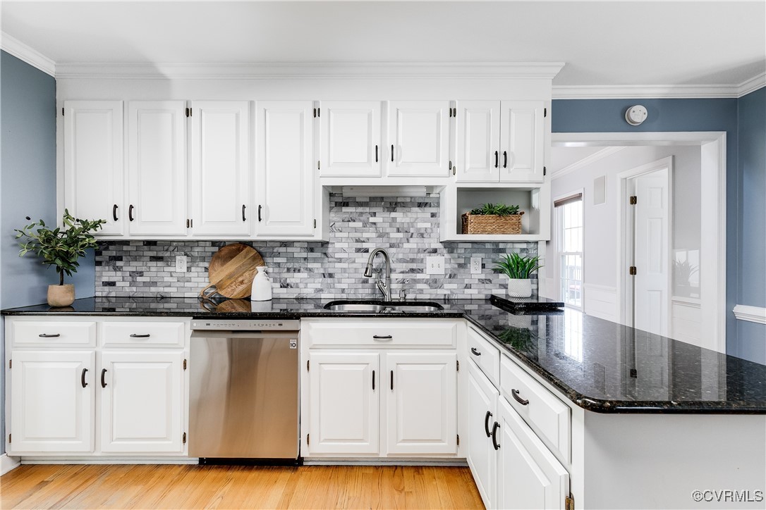 5300 Krag Road Chester, VA 23831 - Photo 13 of 33 a kitchen with granite countertop a sink stainless steel appliances and white cabinets