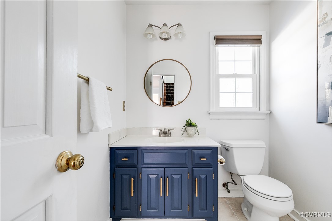 5300 Krag Road Chester, VA 23831 - Photo 15 of 33 a bathroom with a toilet a sink and mirror