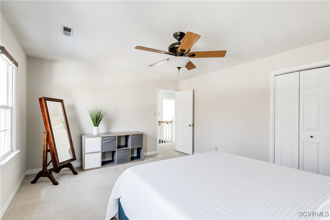 5300 Krag Road Chester, VA 23831 - Photo 23 of 33 a bedroom with a bed a desk and a chandelier