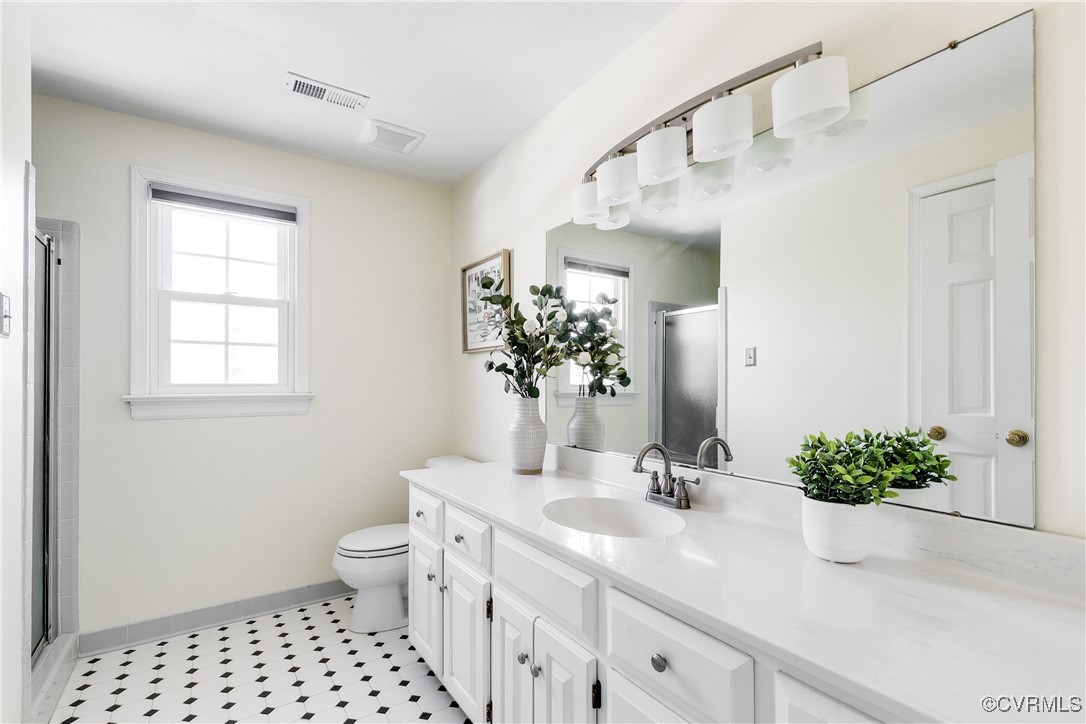 5300 Krag Road Chester, VA 23831 - Photo 28 of 33 a bathroom with a sink a toilet and a mirror