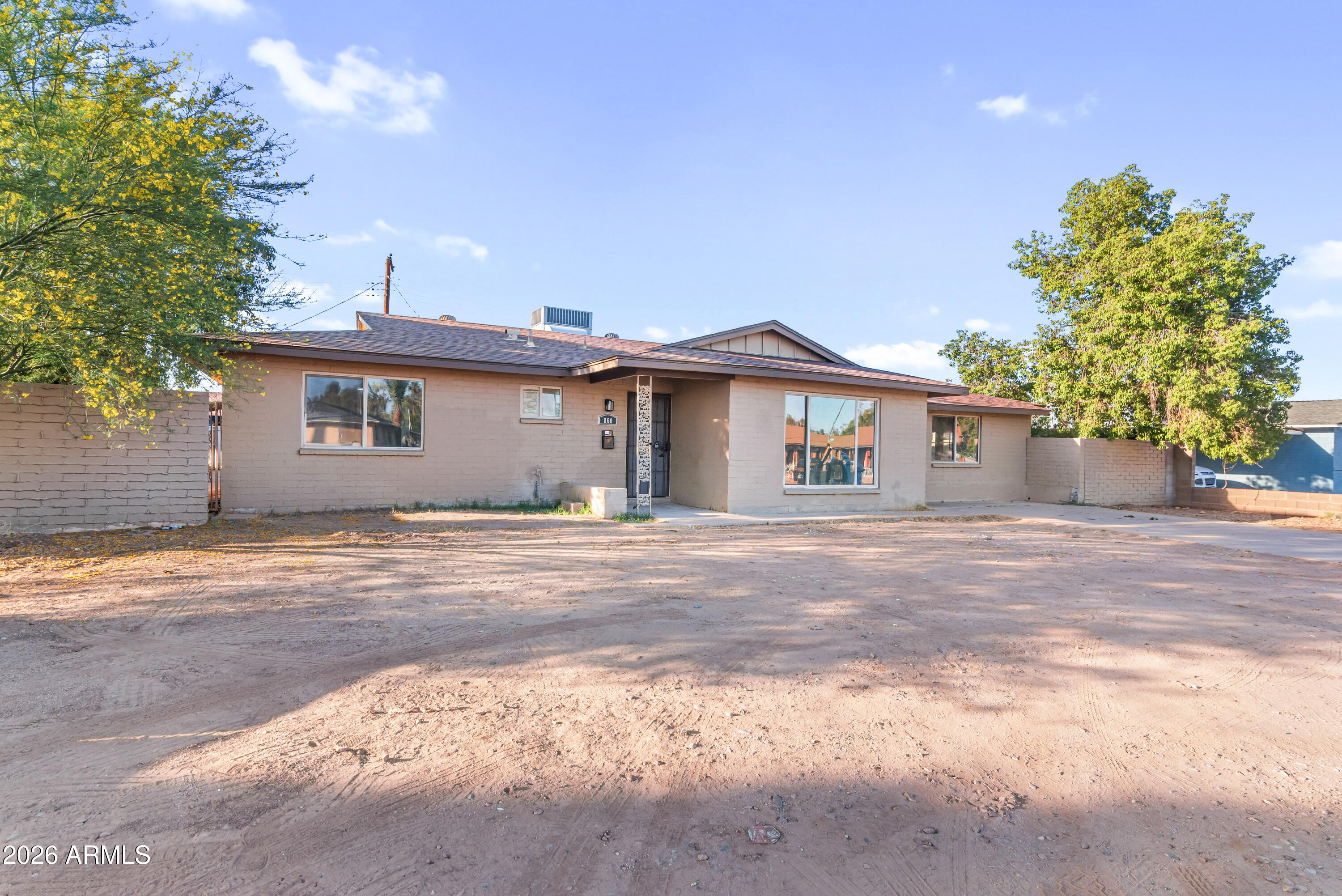860 West McLellan Road Mesa, AZ 85201 - Photo 25 of 26 a front view of a house with a garden