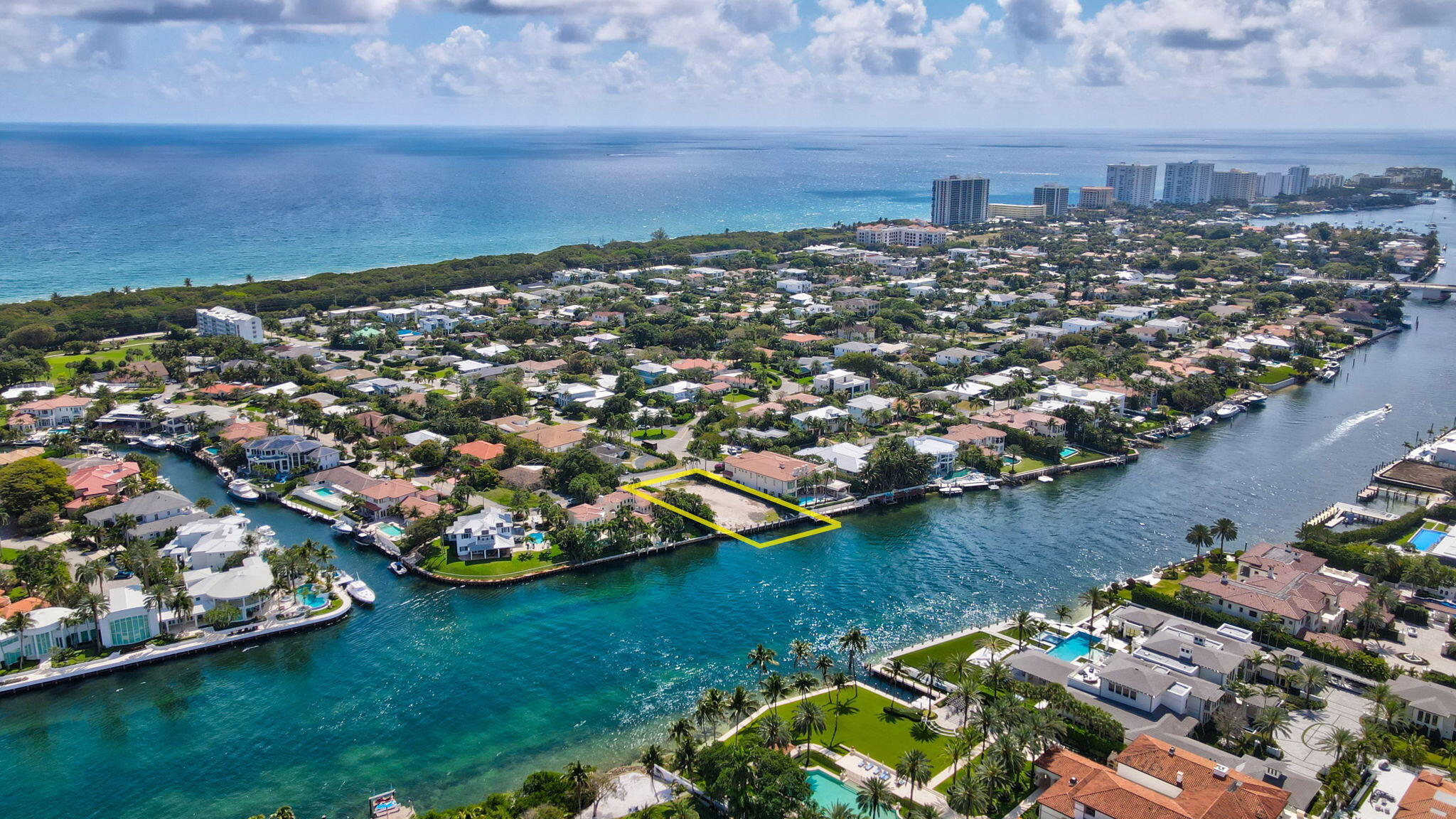 601 Northeast Spanish Trail Boca Raton, FL 33432 - Photo 14 of 16 an aerial view of a city with lots of residential buildings ocean and mountain view in back