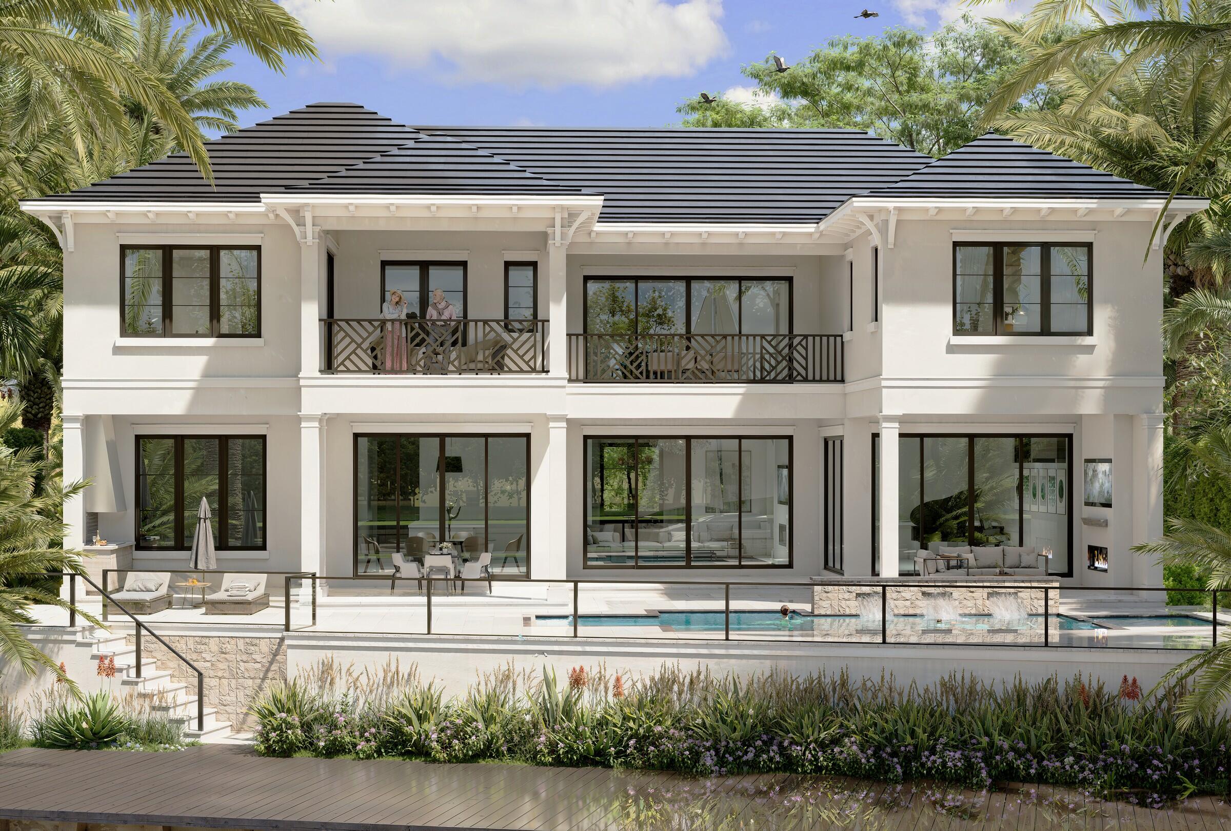 601 Northeast Spanish Trail Boca Raton, FL 33432 - Photo 5 of 16 a view of a white house with large windows and a small yard and potted plants