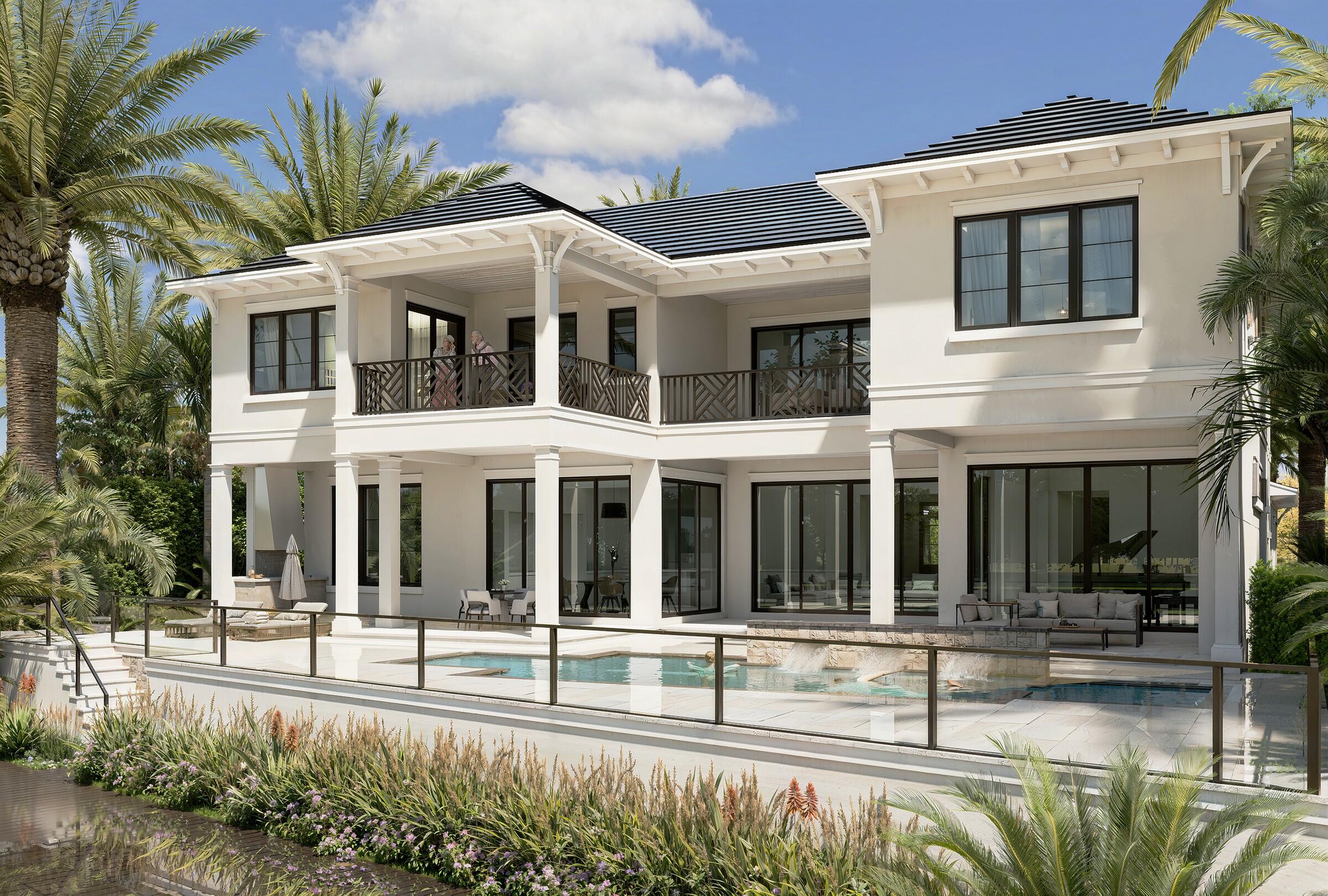 601 Northeast Spanish Trail Boca Raton, FL 33432 - Photo 6 of 16 a view of a white house with a large windows