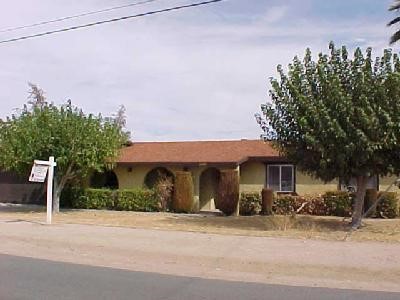 15401 Don Roberto Road Victorville, CA 92394 - Photo 1 of 1 a front view of a house with a yard and garage