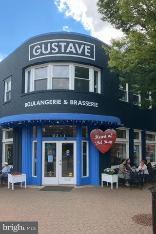 a view of a cafe with sitting area