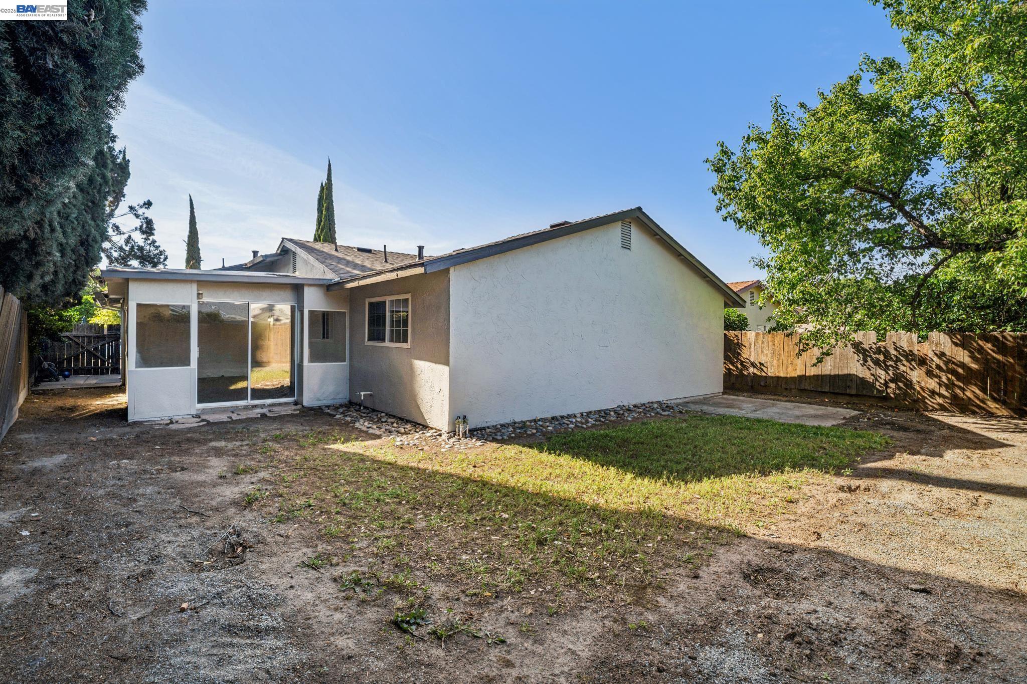 554 Chestnut Avenue Tracy, CA 95376 - Photo 24 of 27 a front view of a house with a yard and garage