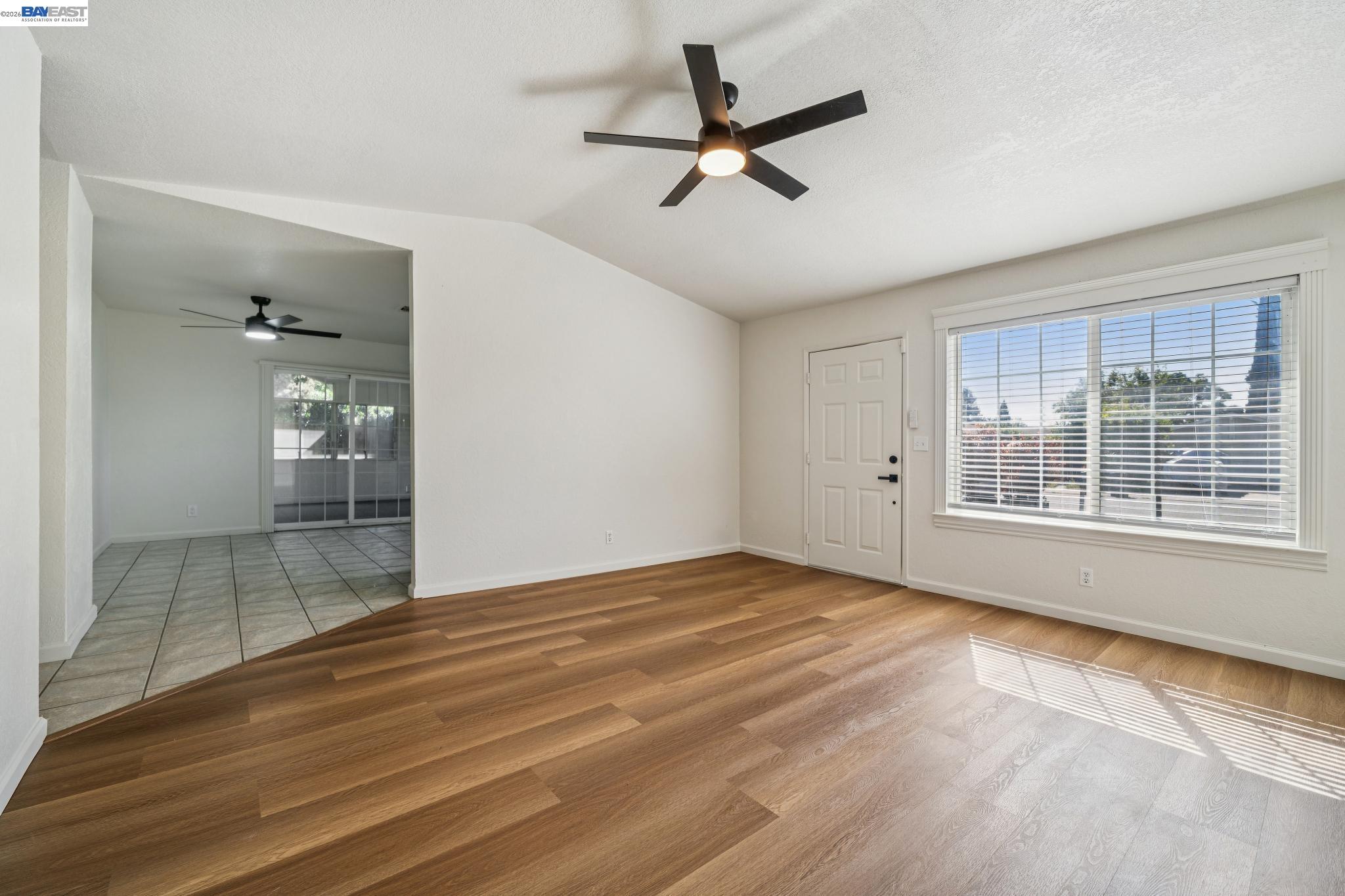 554 Chestnut Avenue Tracy, CA 95376 - Photo 5 of 27 a view of empty room with wooden floor and fan