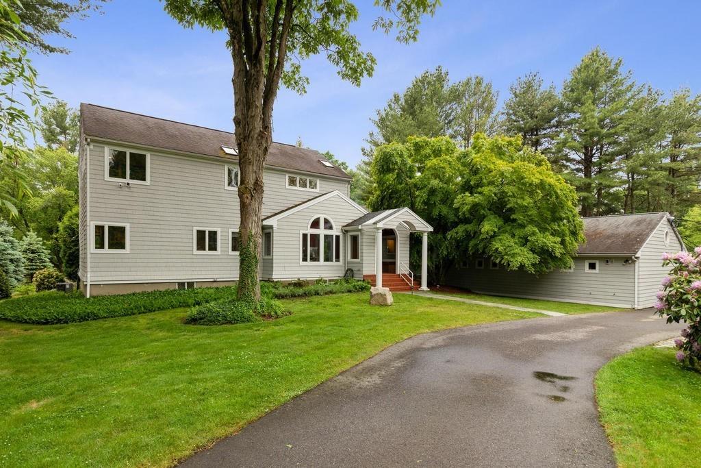 20 Ledgewood Road Weston, MA 02493 - Photo 1 of 34 a front view of a house with a yard and garage