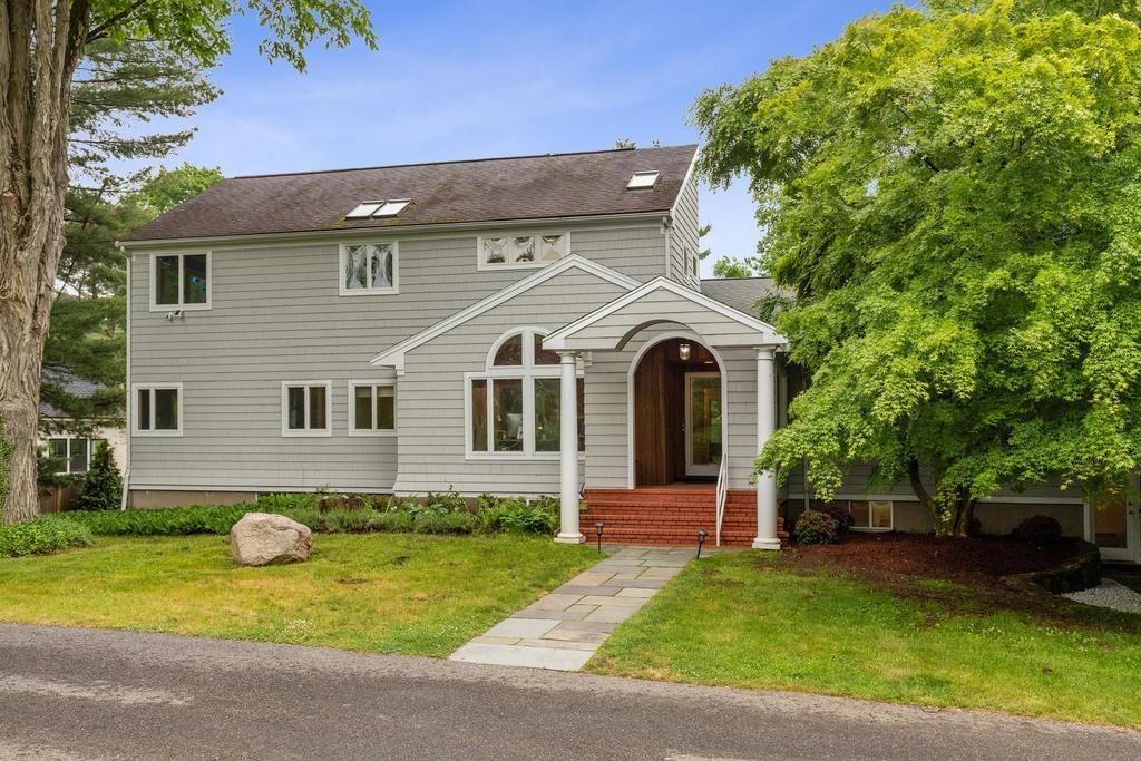 20 Ledgewood Road Weston, MA 02493 - Photo 2 of 34 a front view of a house with garden and porch