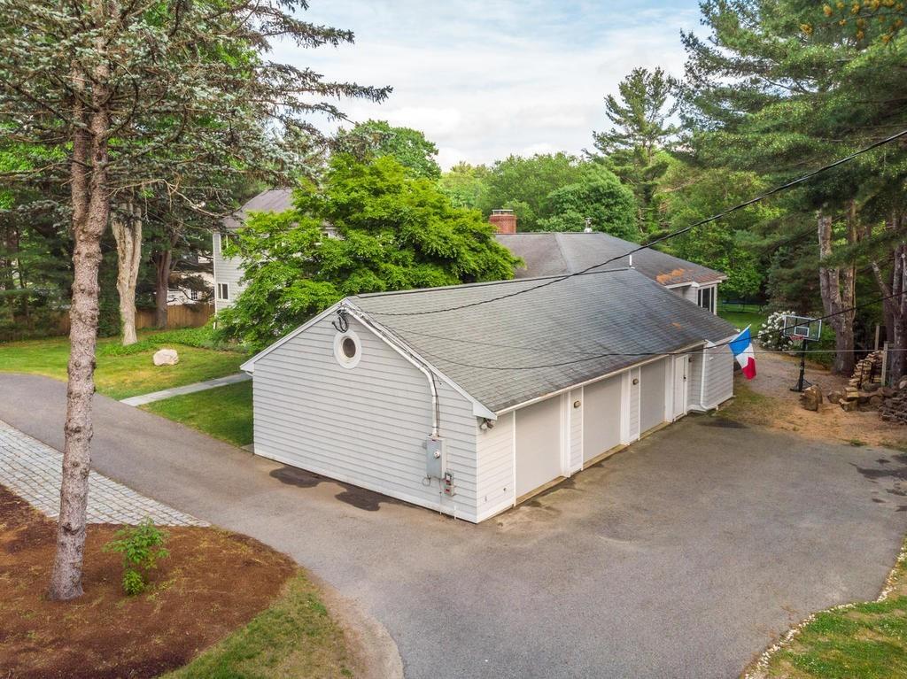 20 Ledgewood Road Weston, MA 02493 - Photo 3 of 34 a white house with tall trees in front of it