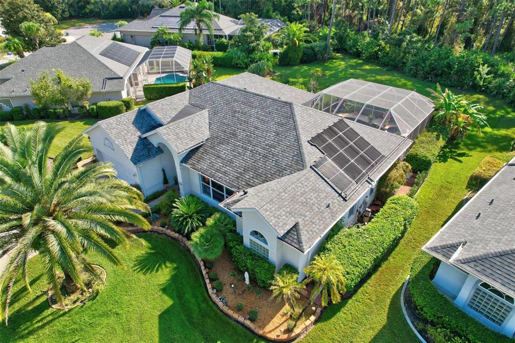 an aerial view of a house with a garden