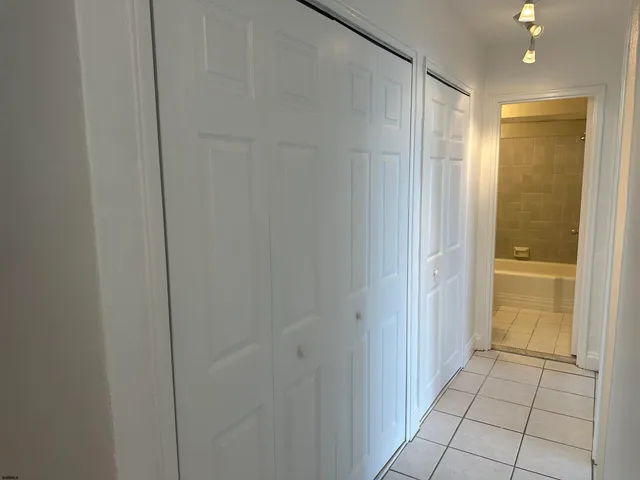 a bathroom with a shower and a sink