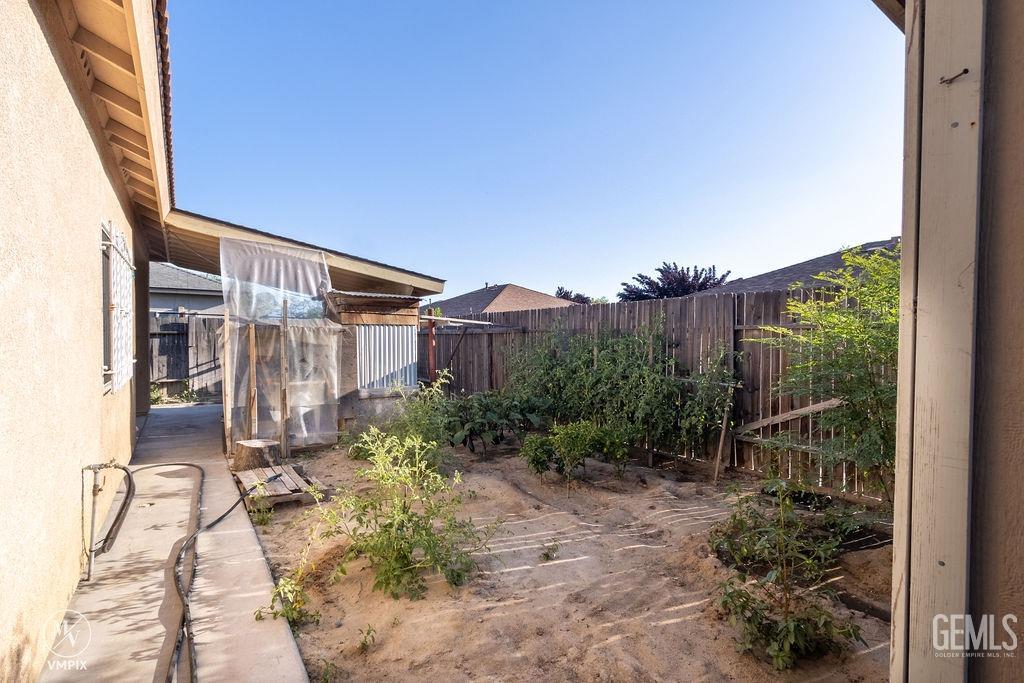 Undisclosed Address Delano, CA 93215 - Photo 15 of 23 a view of a house with a yard