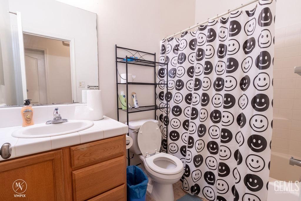 Undisclosed Address Delano, CA 93215 - Photo 9 of 23 a bathroom with a sink and mirror with toilet