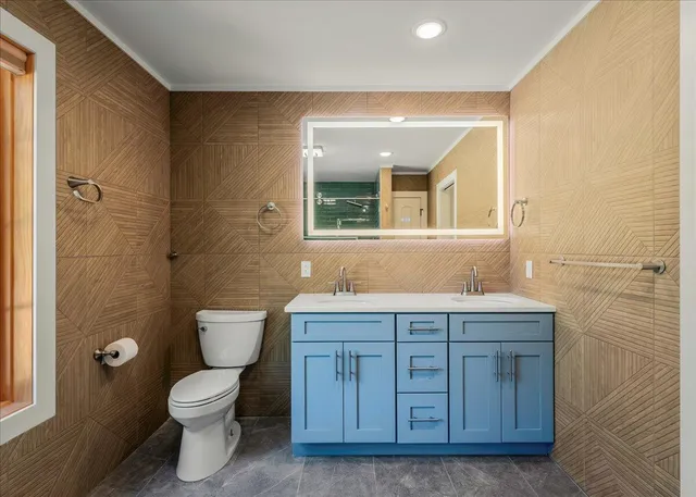 a bathroom with a glass shower door