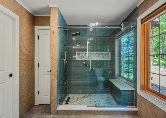 a bathroom with a double vanity sink and a mirror
