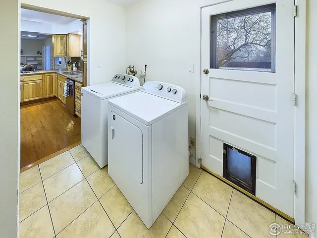 a utility room with a sink a washer and dryer