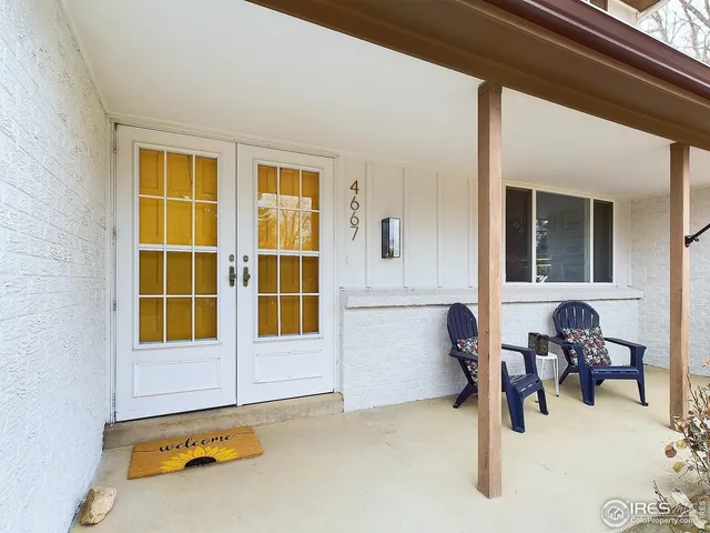 a view of a livingroom with furniture and a window