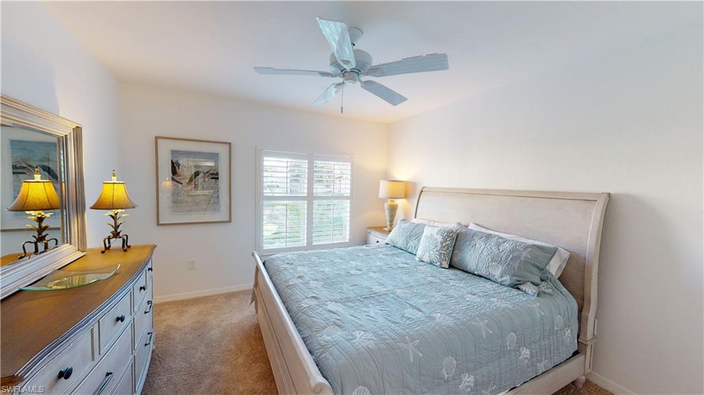 792 Willowbrook Drive, Unit 408 Naples, FL 34108 - Photo 7 of 7 a bedroom with a bed dresser and a window