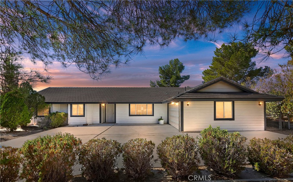 13798 Choco Road Apple Valley, CA 92307 - Photo 1 of 1 a front view of a house with a yard