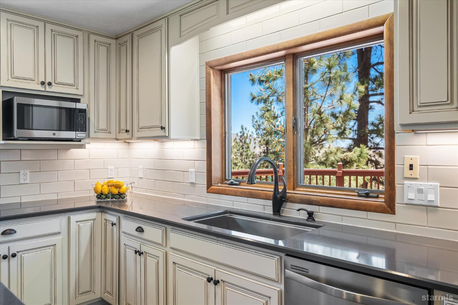 4201 Sandy Circle Carson City, NV 89703 - Photo 16 of 40 a kitchen with a sink and large window