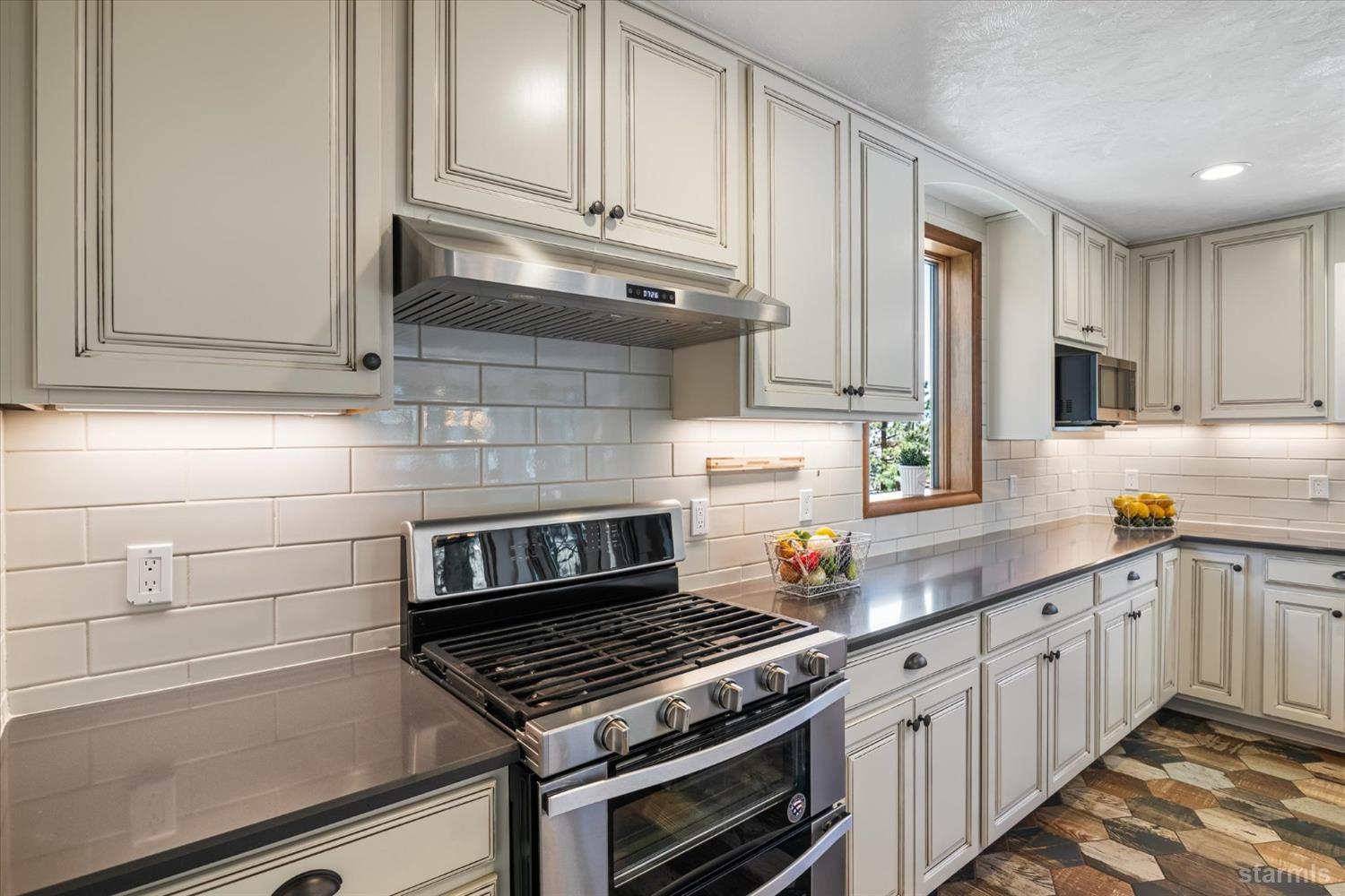 4201 Sandy Circle Carson City, NV 89703 - Photo 17 of 40 a kitchen with granite countertop cabinets and steel stainless steel appliances