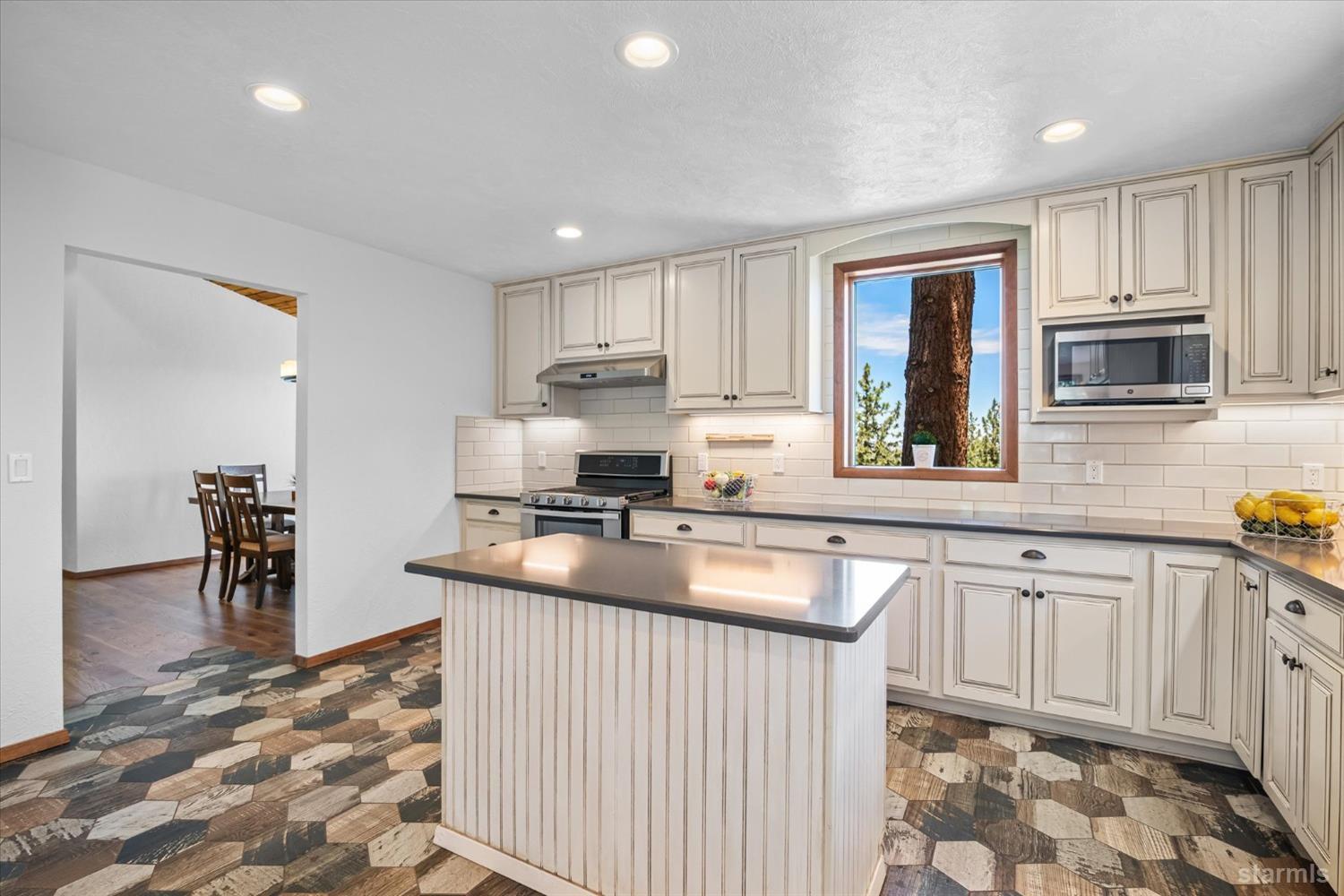 4201 Sandy Circle Carson City, NV 89703 - Photo 18 of 40 a kitchen with stainless steel appliances granite countertop a sink a stove a refrigerator and cabinets