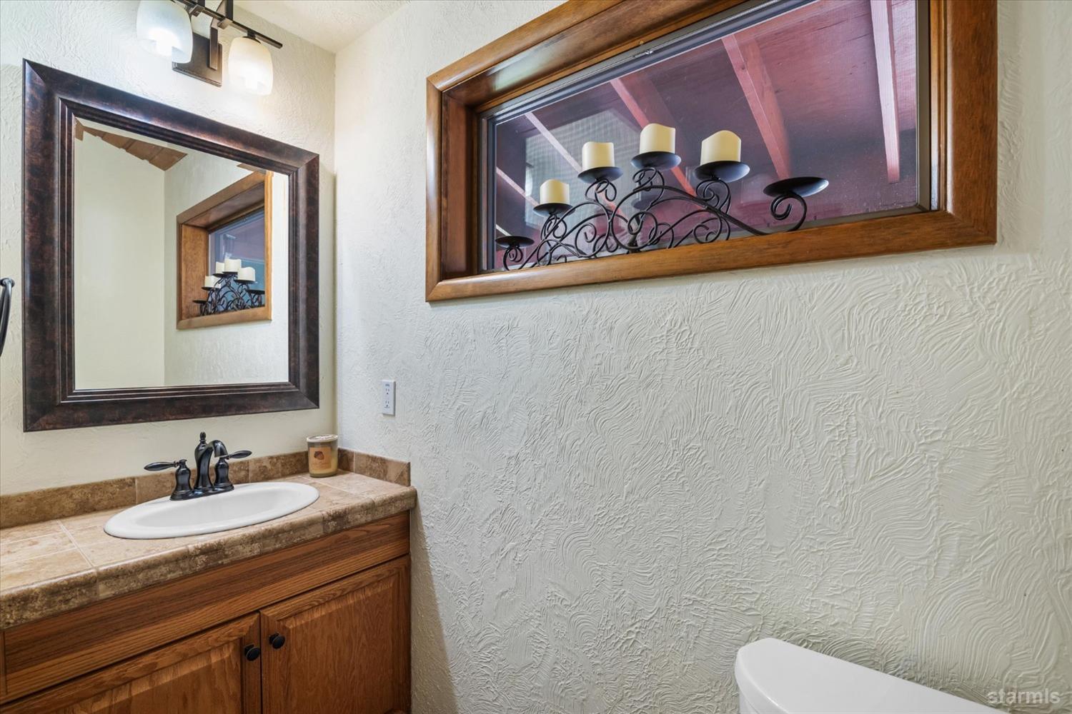 4201 Sandy Circle Carson City, NV 89703 - Photo 27 of 40 a bathroom with a granite countertop sink mirror and vanity
