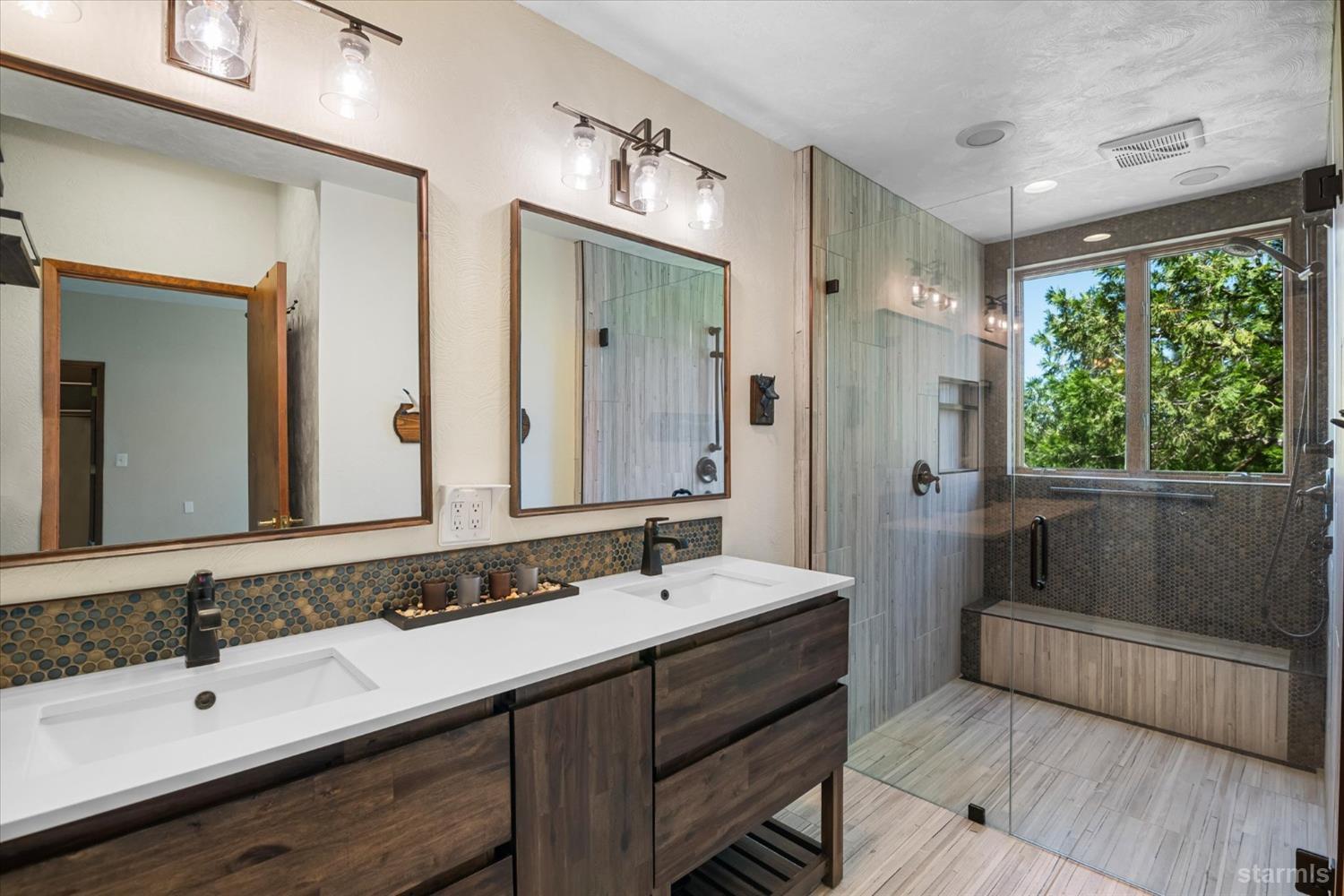 4201 Sandy Circle Carson City, NV 89703 - Photo 30 of 40 a bathroom with a double vanity sink and a mirror