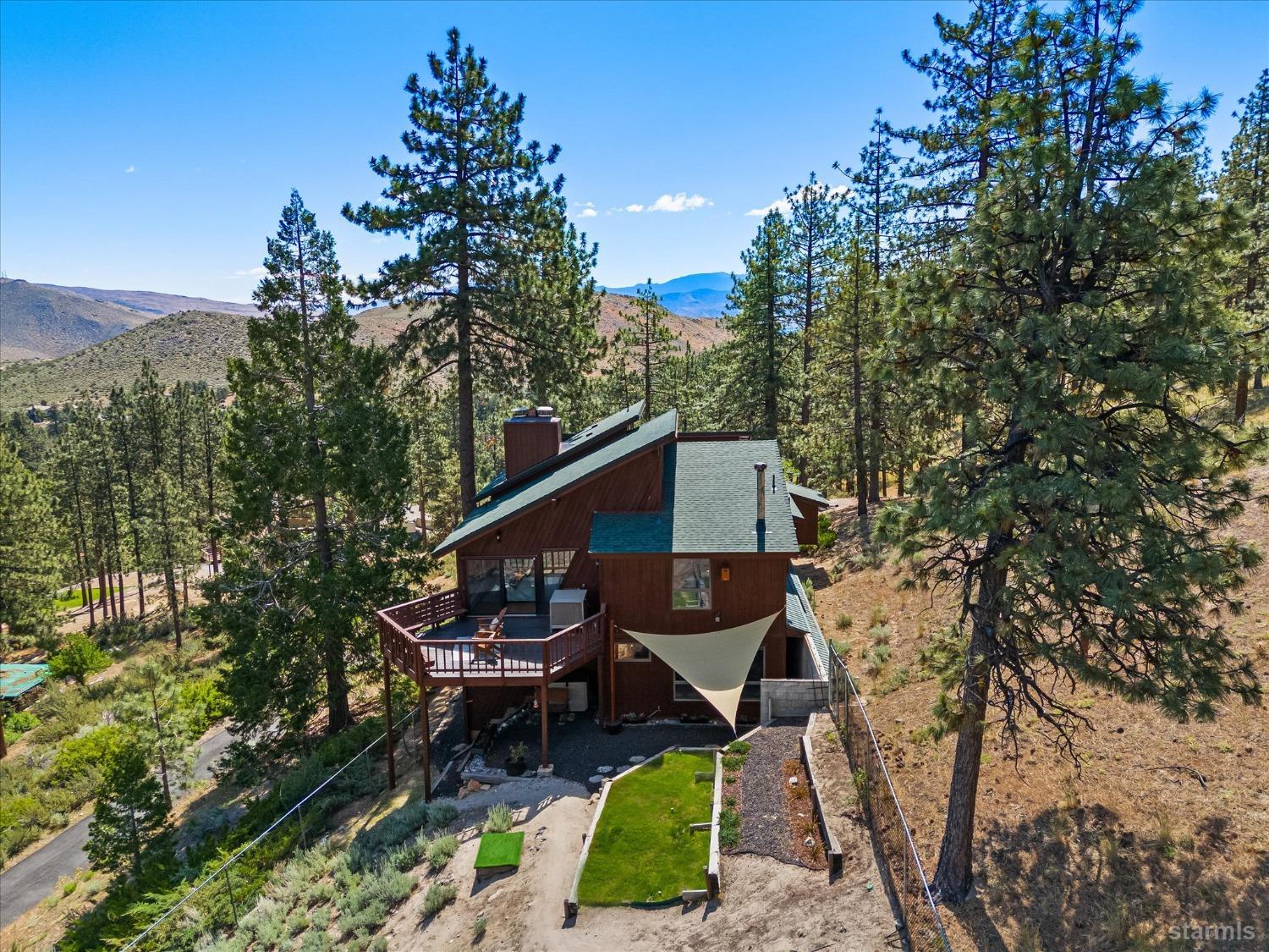 4201 Sandy Circle Carson City, NV 89703 - Photo 6 of 40 a backyard of a house with table and chairs
