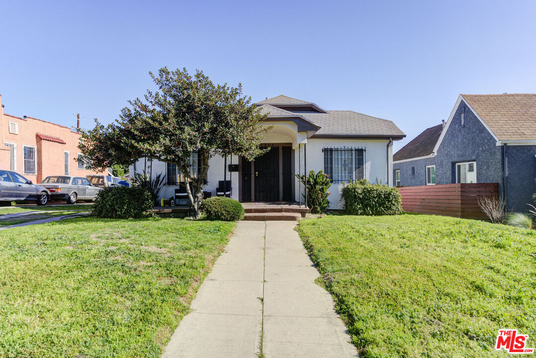 2404 Virginia Road Los Angeles, CA 90016 - Photo 1 of 21 a front view of a house with a yard
