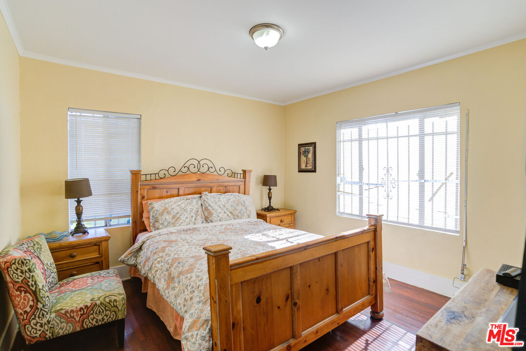 2404 Virginia Road Los Angeles, CA 90016 - Photo 11 of 21 a bedroom with a bed and a couch