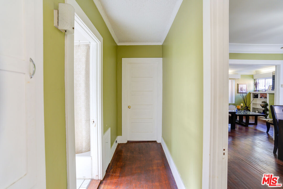 2404 Virginia Road Los Angeles, CA 90016 - Photo 13 of 21 a view of a hallway with wooden floor table and chairs