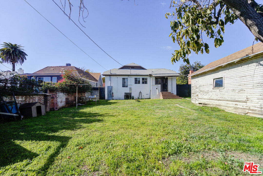 2404 Virginia Road Los Angeles, CA 90016 - Photo 15 of 21 a front view of a house with garden