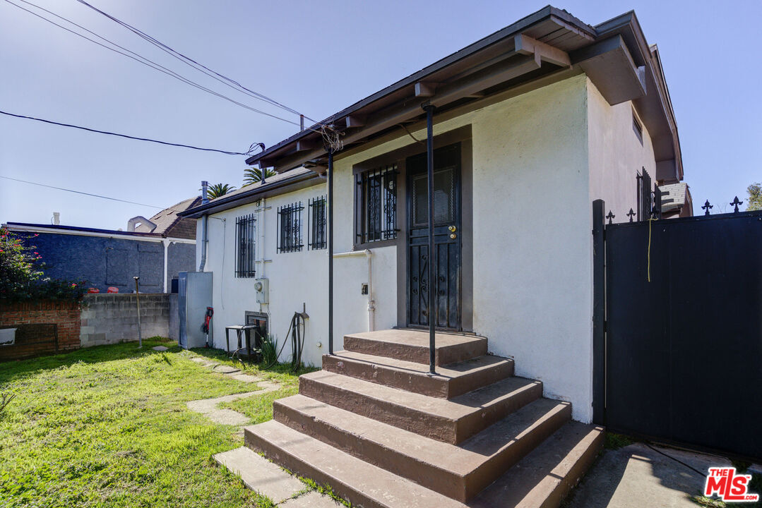 2404 Virginia Road Los Angeles, CA 90016 - Photo 16 of 21 a front view of a house with a garden