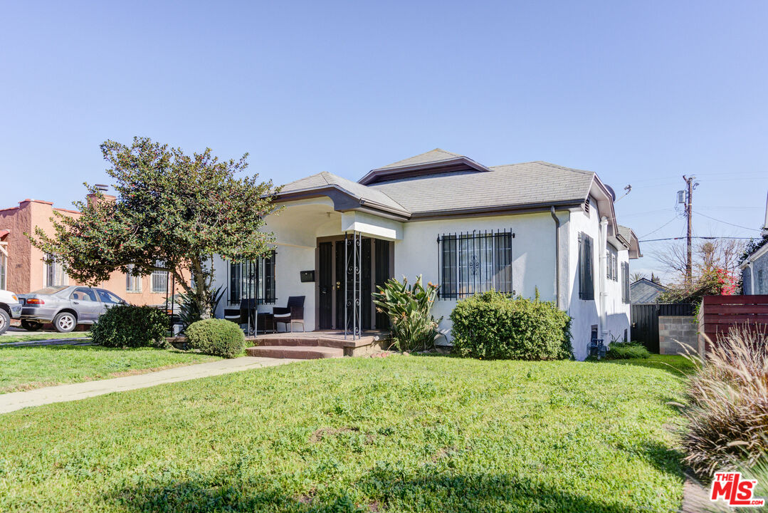 2404 Virginia Road Los Angeles, CA 90016 - Photo 17 of 21 a front view of a house with garden