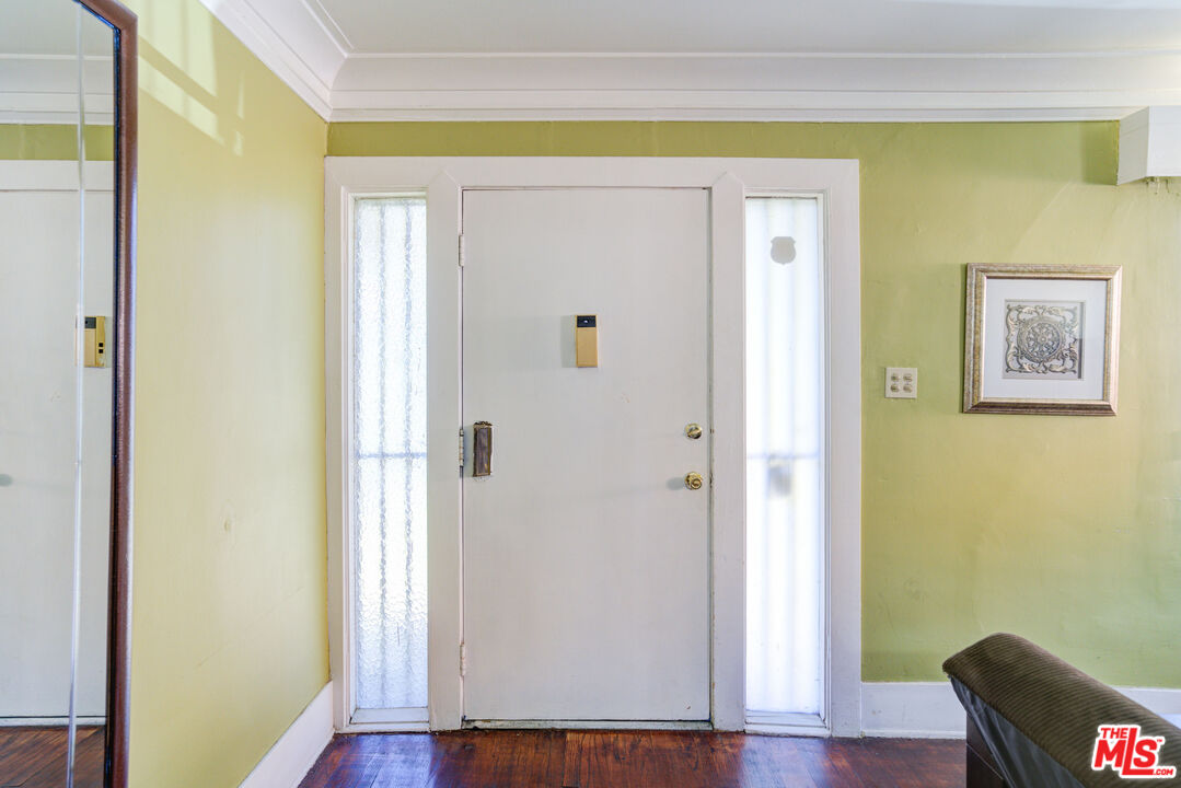 2404 Virginia Road Los Angeles, CA 90016 - Photo 2 of 21 a view of a hallway with wooden floor and closet