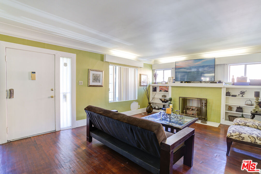 2404 Virginia Road Los Angeles, CA 90016 - Photo 3 of 21 a living room with furniture and a fireplace