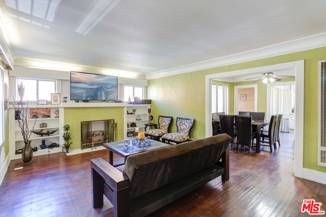 2404 Virginia Road Los Angeles, CA 90016 - Photo 4 of 21 a living room with furniture and a fireplace