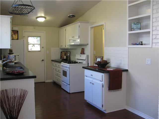 14125 Frame Road Poway, CA 92064 - Photo 8 of 25 Yet another angle of the kitchen---the doorway you see leads to an awesome storage pantry, the half bath and a room that will serve nicely as an office, a playroom or a possible bedroom~~