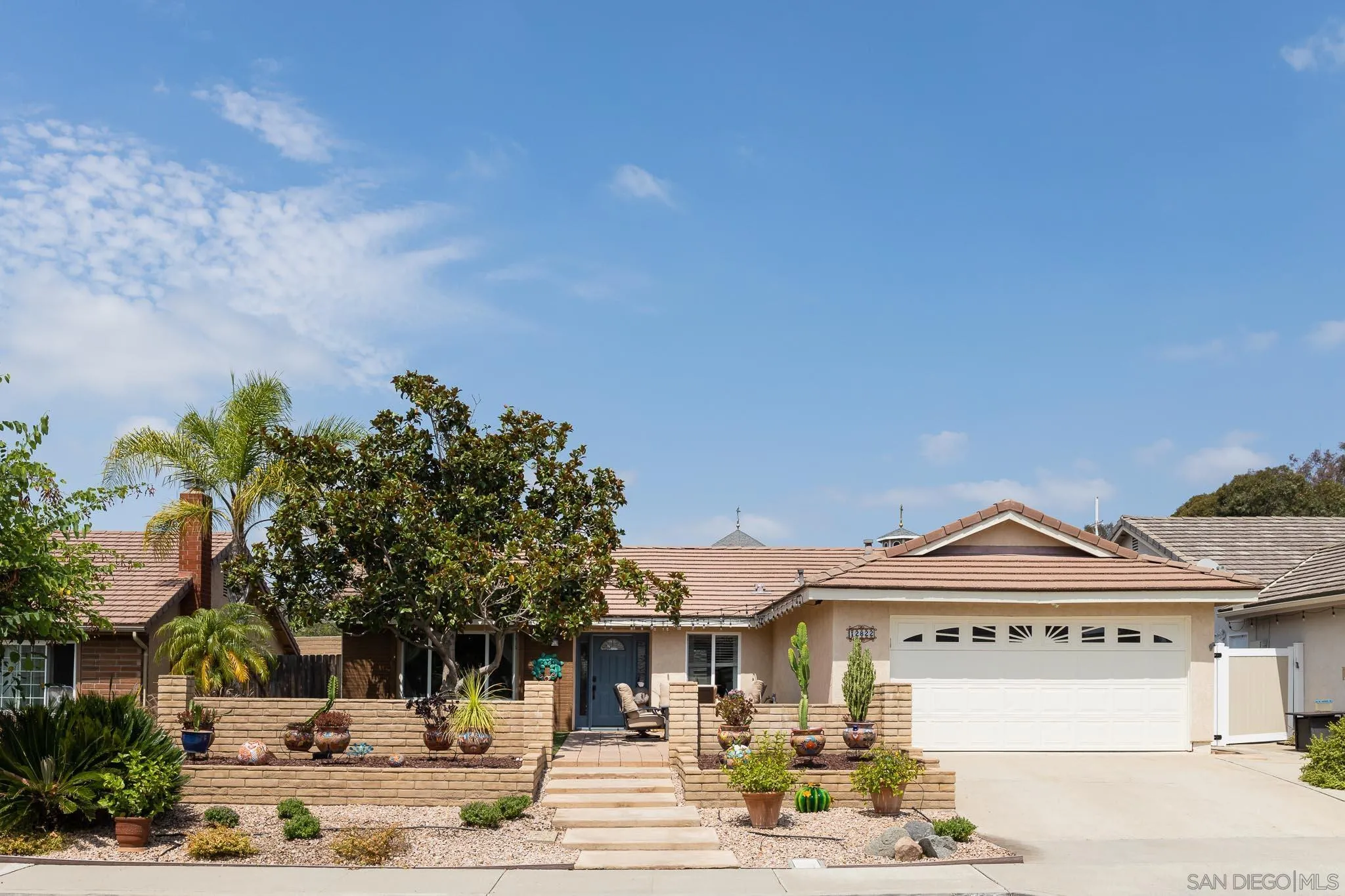 12822 Pinefield Road Poway, CA 92064 - Photo 1 of 23 a view of a big building next to a road