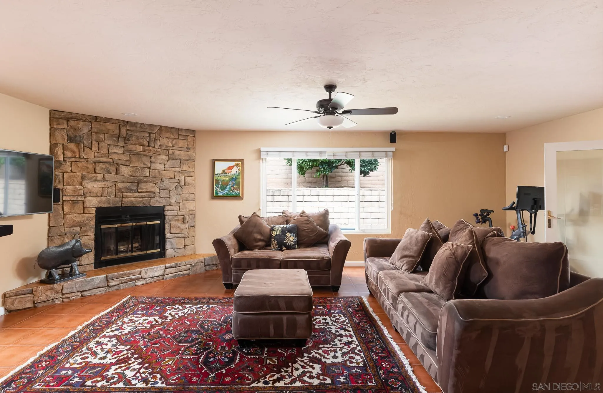 12822 Pinefield Road Poway, CA 92064 - Photo 11 of 23 a living room with furniture and a fireplace