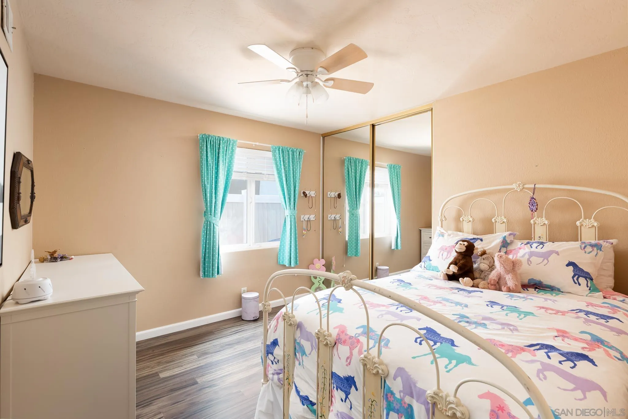 12822 Pinefield Road Poway, CA 92064 - Photo 18 of 23 a bedroom with a bed and a chandelier