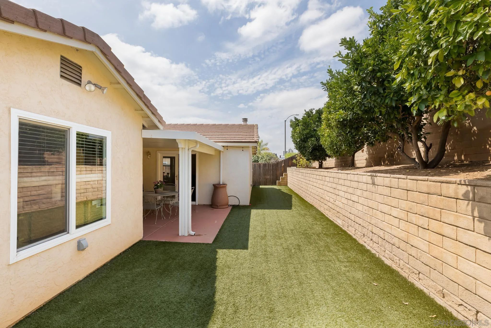12822 Pinefield Road Poway, CA 92064 - Photo 19 of 23 a view of a house with backyard and sitting area