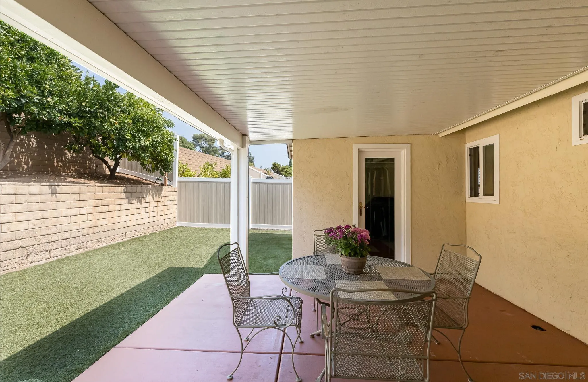 12822 Pinefield Road Poway, CA 92064 - Photo 21 of 23 a view of a patio with table and chairs and potted plants