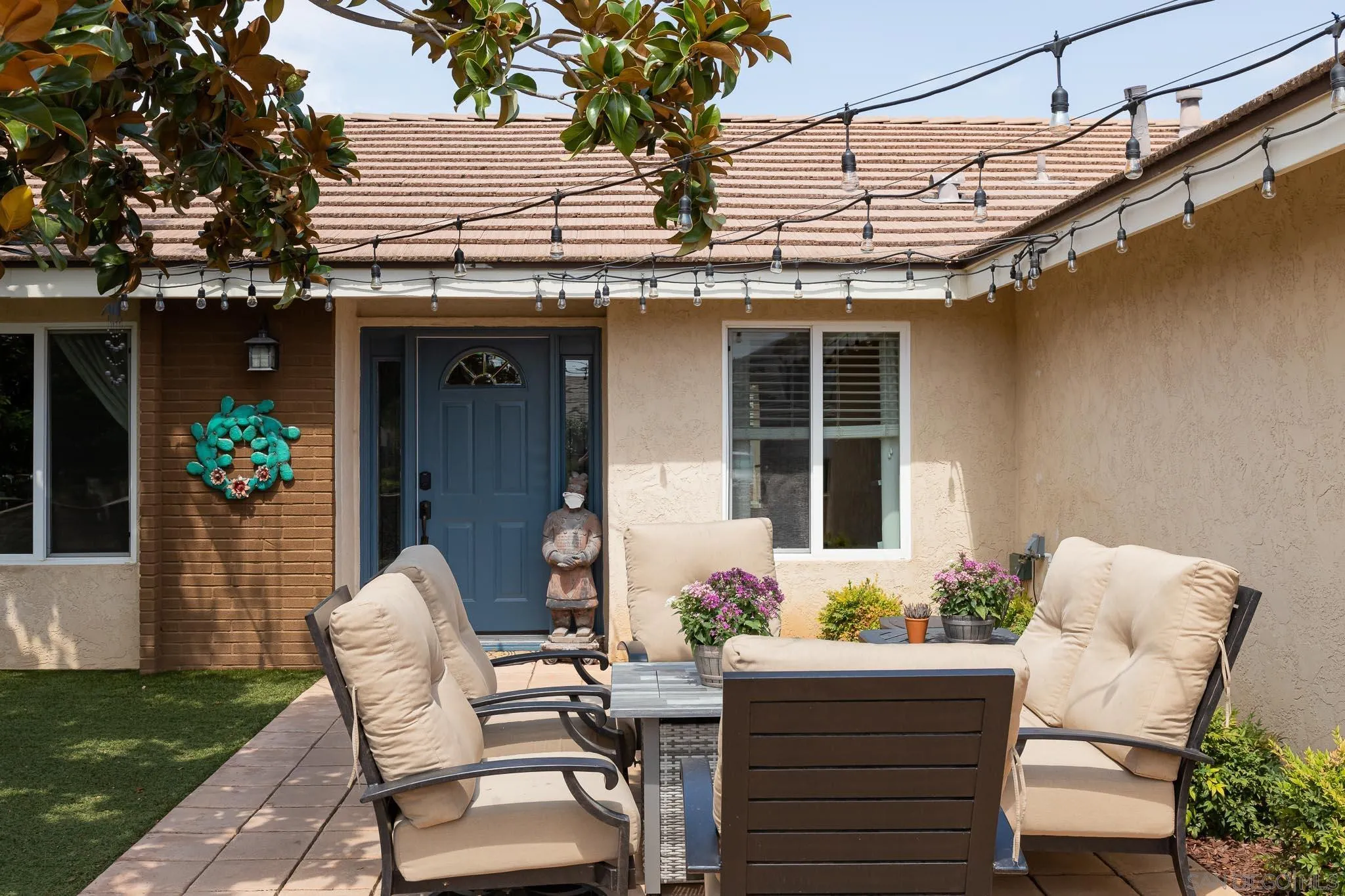12822 Pinefield Road Poway, CA 92064 - Photo 5 of 23 a view of a patio with table and chairs and potted plants