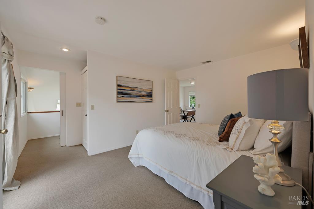 4542 Thomas Road Sebastopol, CA 95472 - Photo 28 of 60 a bedroom with a bed and a refrigerator