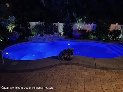 241 Privateer Road Manahawkin, NJ 08050 - Photo 2 of 44 a view of a pool with sitting area