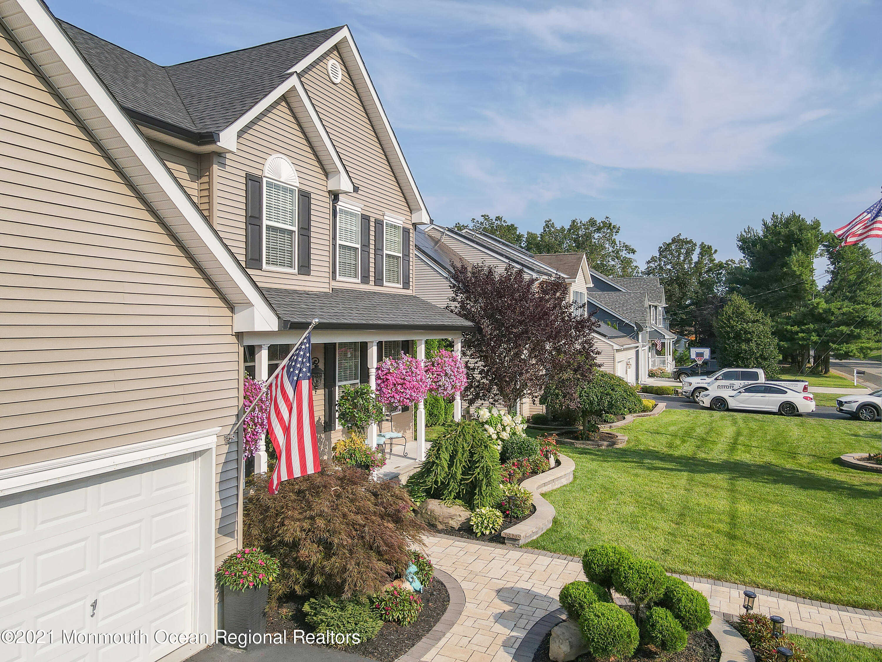 241 Privateer Road Manahawkin, NJ 08050 - Photo 11 of 44 a front view of house and yard with green space